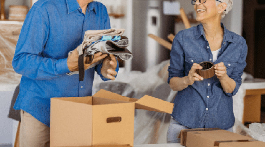 elderly couple packing up for a move